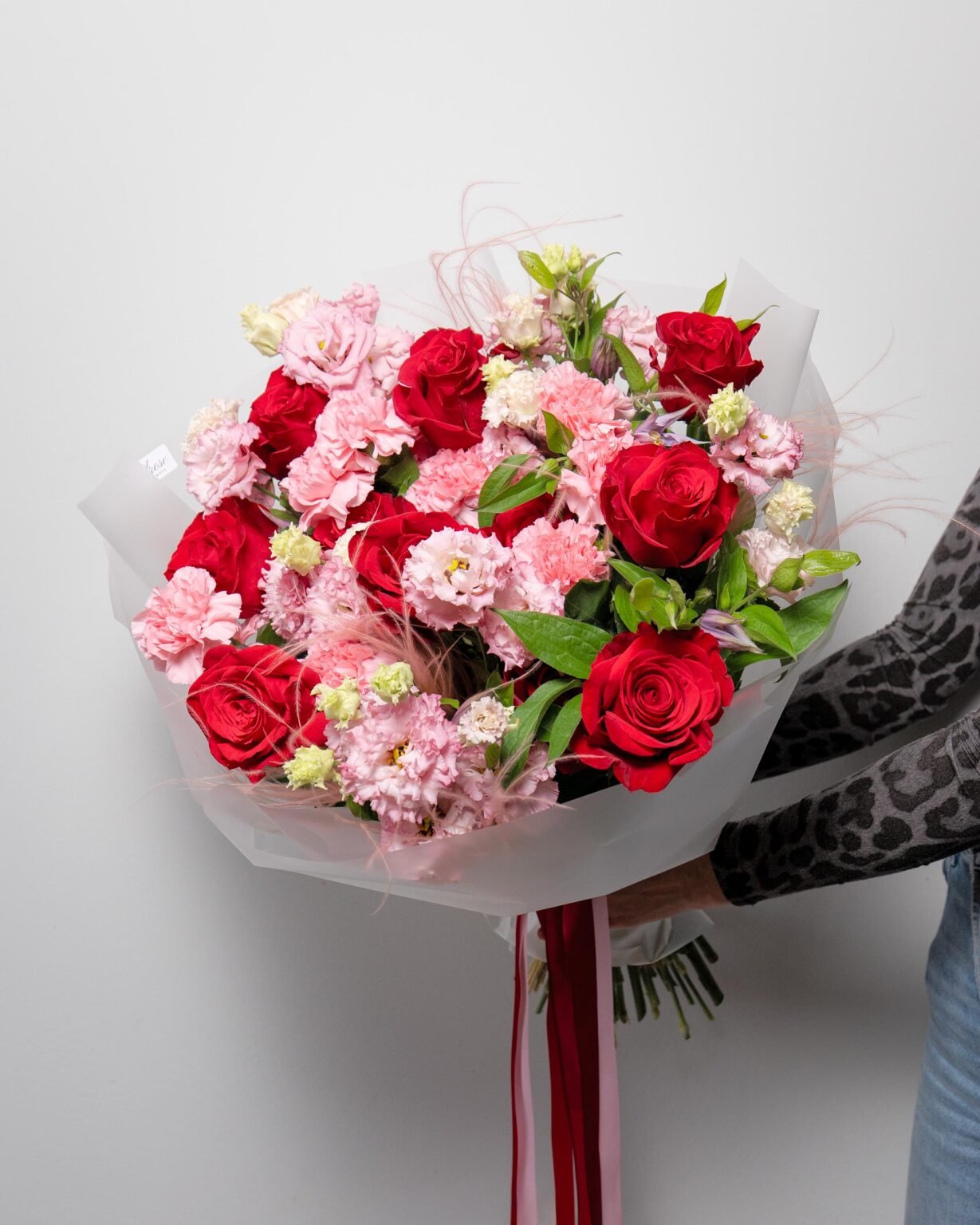 Red roses mixed with other flowers