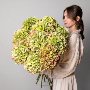Large green hydrangea bouquet with soft natural tones